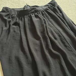 Long black overlay to mini skirt under.